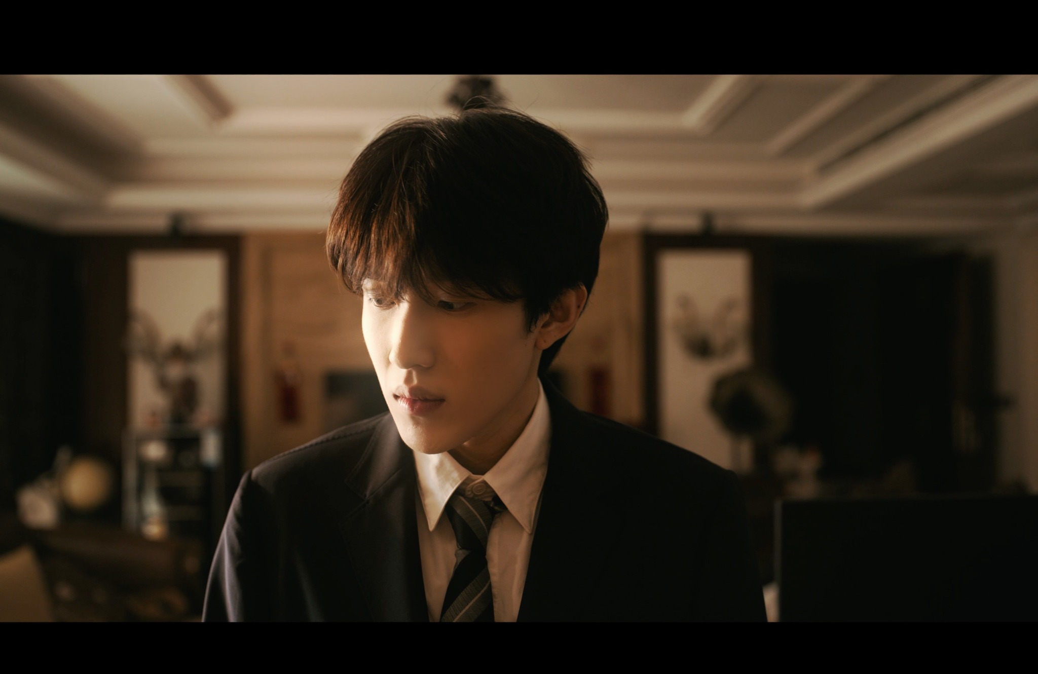 Barry Songting Wei in a warm-lit cinematic portrait